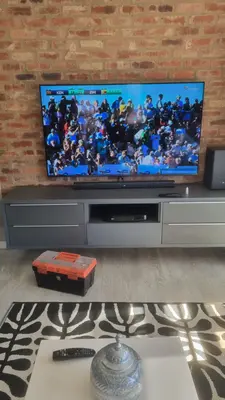 TV wall mount with soundbar showing SuperSport rugby